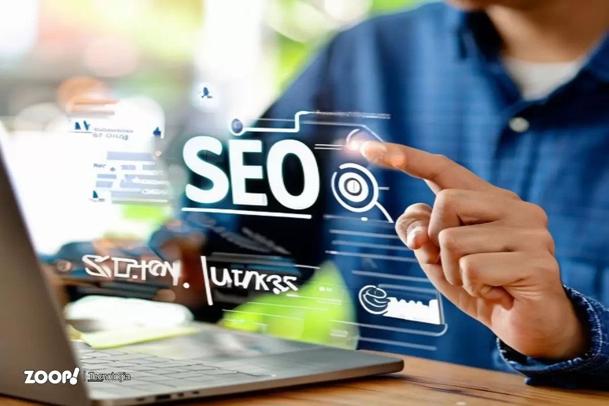 Um profissional de SEO trabalhando em seu notebook ilustra nosso artigo sobre: Evolução do SEO: a história da estratégia de geração de tráfego. Um profissional de SEO trabalhando em seu notebook ilustra nosso artigo sobre: Evolução do SEO: a história da estratégia de geração de tráfego.